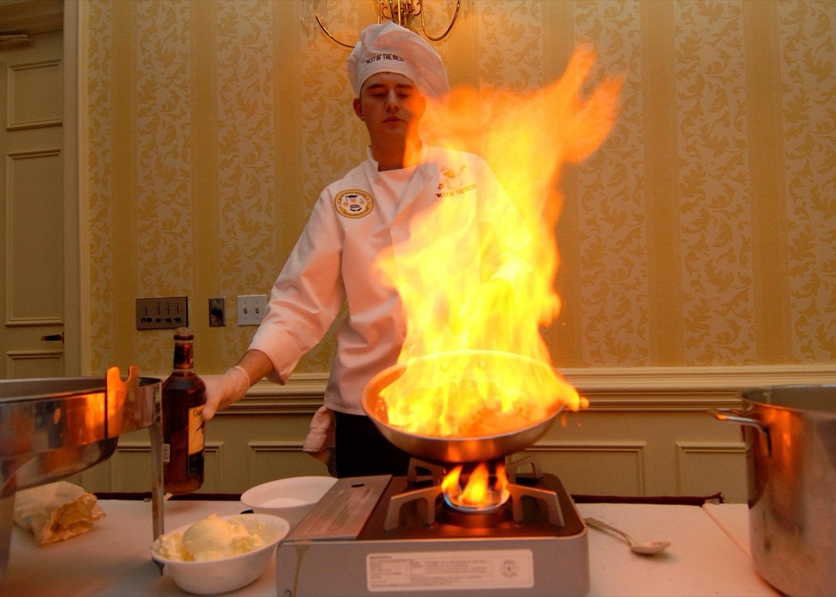 Chef cooking stew in modern kitchen